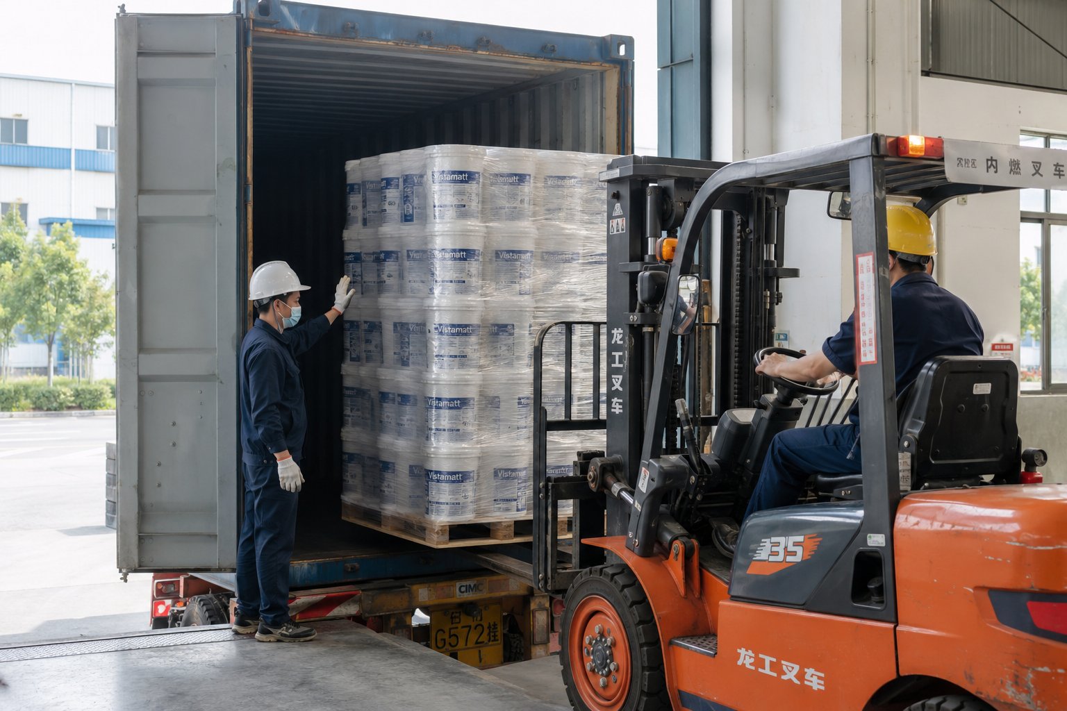 Vistamatt export loading — forklift loading Vistamatt pallets into shipping container for international delivery